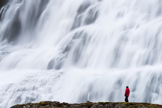 Dynjandi Foss waterfall, with tourist, Westfjords, Iceland, Europe