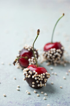 Close-up of chocolate covered cherries and quinoa on table