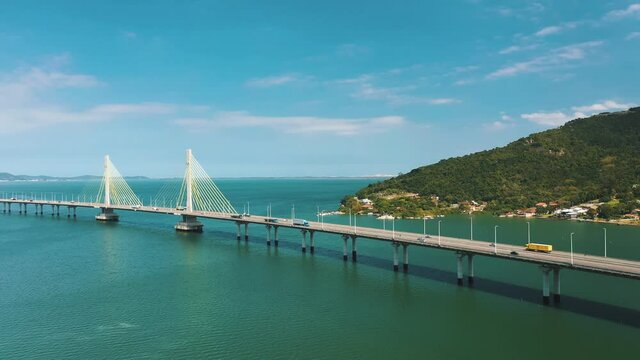 Amazing panoramic aerial shot along Anita Garibaldi bridge above the ocean, located in Laguna, Santa Catarina, Brazil