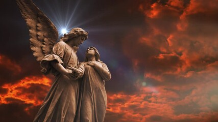 angel statue with orange cloud background