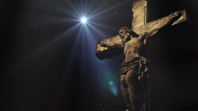 Jesus statue with spotlight background