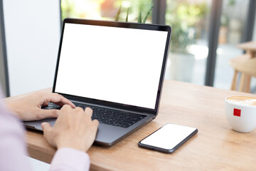 computer,cell phone mockup.hand woman work using laptop texting mobile.blank screen with white background for advertising,contact business search information on desk in cafe.marketing,design