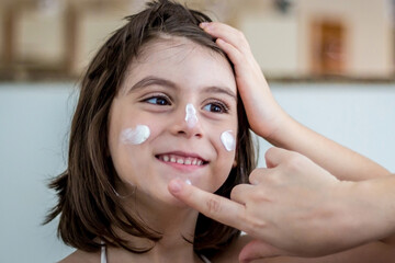 Mother Applying Sunscreen
