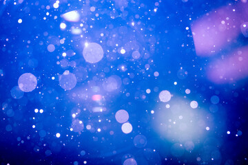Fototapeta na wymiar Fantasy Abstract blur blue bokeh of lights colorful sparkle