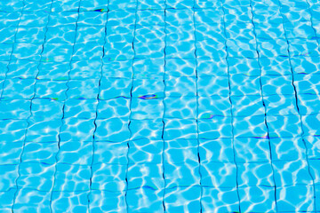 Blue ripe water reflection in swimming pool