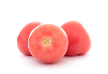 Three fresh tomatoes on white background