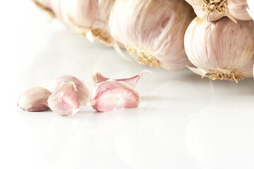  White garlic head heap and Garlic cloves