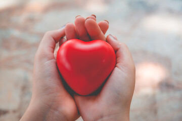 Fototapeta premium Woman hold red heart