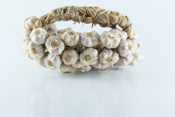 Bundle of garlic isolated on white backgrond.