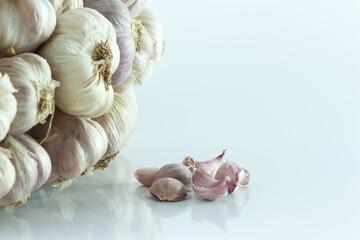 Fototapeta na wymiar White garlic head heap and Garlic cloves