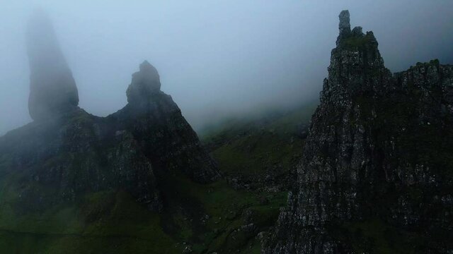 Famous Old Man Of Storr (Bodach an Stoir) Obscured In Fog At Early Morning In Trotternish Peninsula Of The Isle Of Skye In Scotland, UK. - aerial drone shot