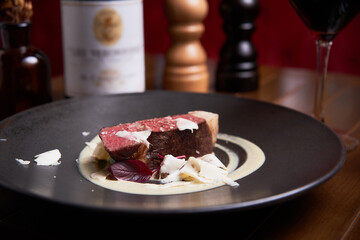 Ribeye with white truffle slides in high cuisine restaurant