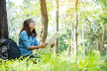 Happy hipster asian tourist travel in Asia backpack with smiling face and happiness laugh. Beautiful woman backpack around the word. Young traveller concept. Young traveller lifestyle