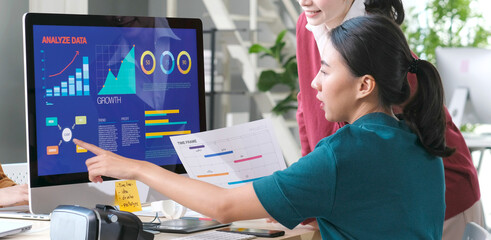   Asian women discussing about business plan, Asia female team analyze business data at office