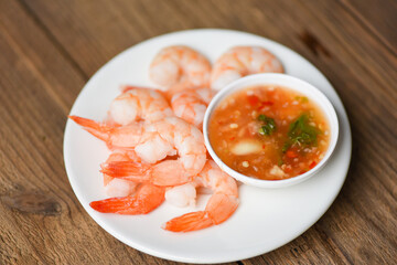 Shrimp delicious seasoning spices on white plate appetizing cooked boiled shrimps prawns salad shelfish seafood sauce