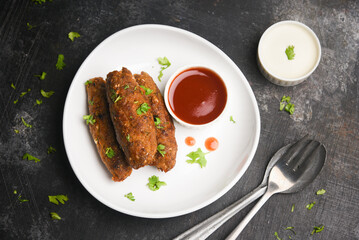 indian chicken tikka shish kofte kebabs. Delicious homemade Indian Starter Mixed Vegetable Kebab Platter dipped in mayonnaise coriander leaf. Seekh Kebab grilled meat skewers, Turkish and Arabic food.