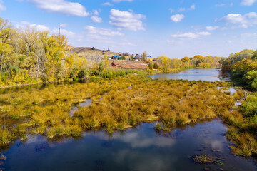 Sakmara river and Red Mountain camping on the shore. The picture was taken in Russia, in the Orenburg region, in the village of Saraktash