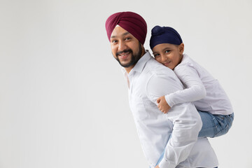 A SIKH SON AND FATHER ENJOYING TIME TOGETHER	