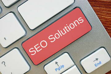 SEO Solutions  inscription on the sheet.