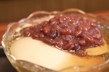 Close up shot of tofu pudding with red beans