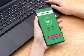 Female using mobile smart phone online confirm payment for online shopping mobile payment. Concept banking and online shopping mobile payment.