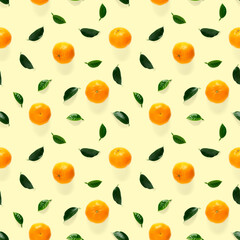 Mandarine seamless pattern, tangerine, clementine isolated on yellow background with green leaves. Collection of fine seamless patterns.