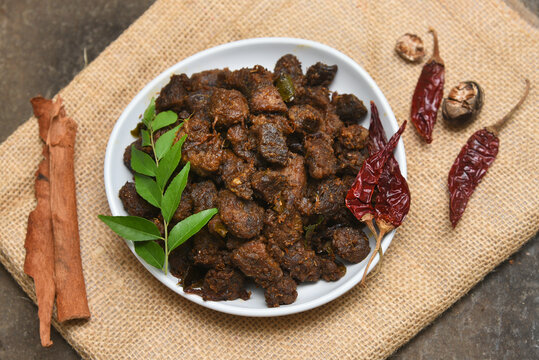 Kerala style beef or Mutton dry fry. delicious spicy Beef fry . beef curry for ghee rice, kappa, appam, parotta, puttu, bread and chappathi, beef roast. Indian cuisine .