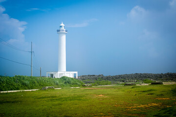 Cape Zanpa Lighthouse, Okinawa, Japan with blue sky and surrounding scenery