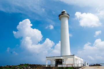 Cape Zanpa Lighthouse, Okinawa, Japan with blue sky and surrounding scenery