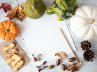 White empty paper with autumn decor on the table