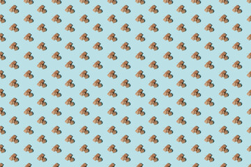 Blue abstract background. Beige seamless pattern. Vintage gift parcel. Holiday present. Minimalist symmetrical composition of rustic handmade eco box pile isolated on light.