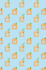Fototapeta premium Houses made of craft paper and green leaves of a plant on a light blue background. Eco-friendly home concept, healthy lifestyle, zero waste...