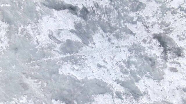 Top view of the icy sea. Ice formations from the air.