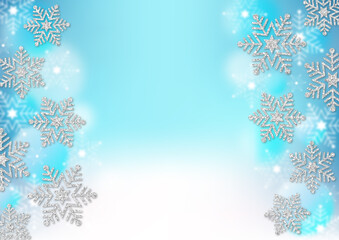銀色のラメの雪の結晶　水色のグラデーション背景　ふわふわの透明なドット　冬のフレーム素材