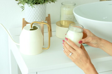 Hands  woman with a candle holder