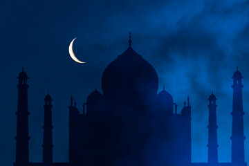 Mysterious foggy night with crescent moon over Taj Mahal in India, Agra