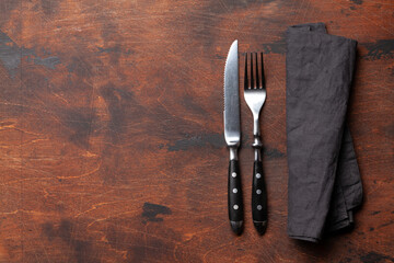Wooden table with knife and fork