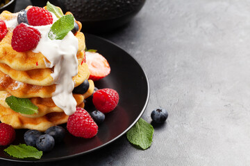 Delicious belgian waffles with summer berries