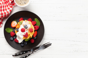 Delicious belgian waffles with summer berries