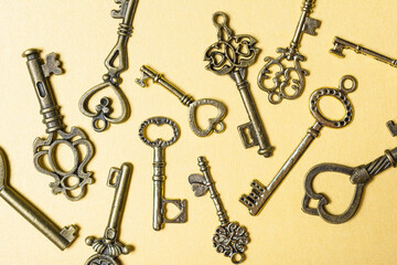 Set of old vintage door keys on golden background