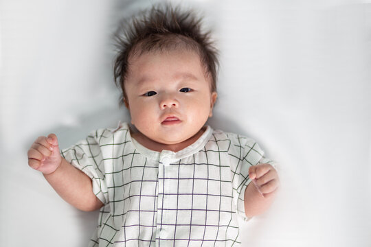 Portraiture image of Three month old Asian Cute little baby boy lsolated on white background