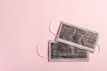 Medical carbon protective face mask for cover mouth, studio shot isolated on pink background, Safety healthcare medical prevent coronavirus or Covid-19