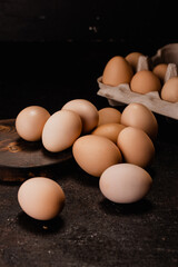 Fresh chicken eggs in carton egg tray or wood boxes