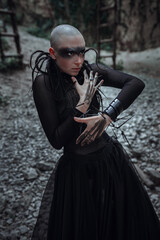 Beautiful young bald woman portrait outdoors. spiritual concept.