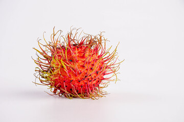 Naklejka premium one rambutan sweet delicious fruit isolated on white background