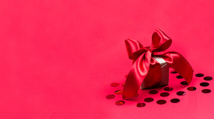 Christmas gift and Valentine's day in wrapping paper on a red background