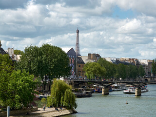embankments and bridges of the Seine in Paris with boats and barges