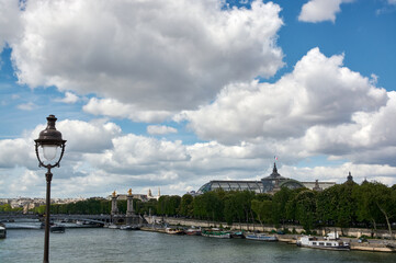 embankments and bridges of the Seine in Paris with boats and barges