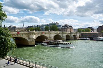 embankments and bridges of the Seine in Paris with boats and barges