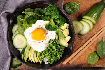 vegetable, rice and egg in cooking pan